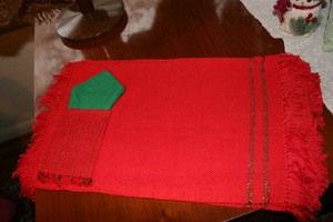 Red placemat with green napkin inset