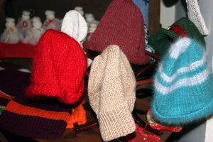 Variaty of knitted hats on display